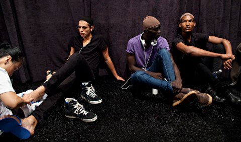 Models wait during the Nicholas K Spring/Summer 2013 collection during New York Fashion Week, Sept. 6, 2012. 