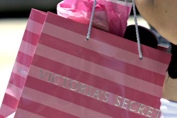 A woman carries a Victoria Secret bag along Lincoln Road in