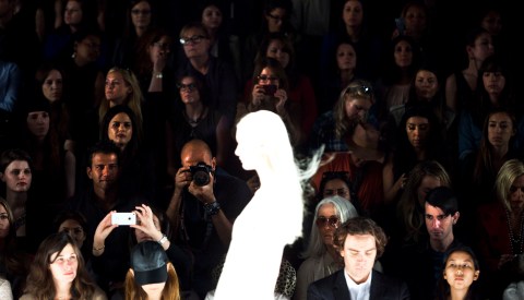 Audience members watch a model during the J. Mendel Spring/Summer 2013 show at New York Fashion Week, Sept. 12, 2012. 